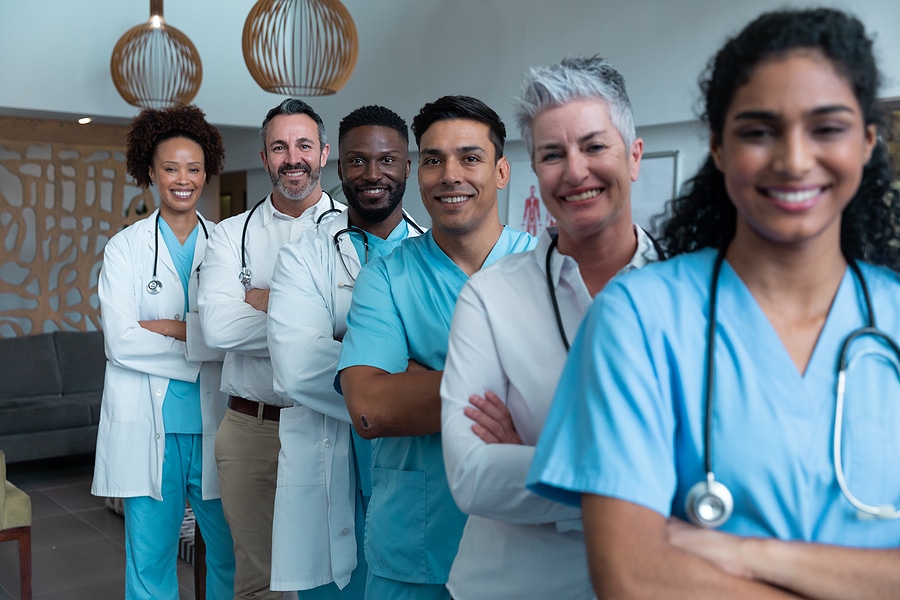 Portrait of group of diverse male and female doctors standing